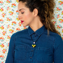 Pendant with Hand Embroidered Yellow Flowers.