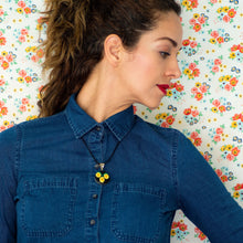 Pendant with Hand Embroidered Yellow Flowers.