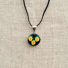 Pendant with Hand Embroidered Yellow Flowers.